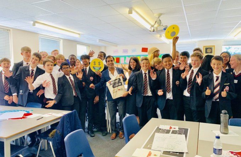 Rehman with students at Rainham Mark Grammar School