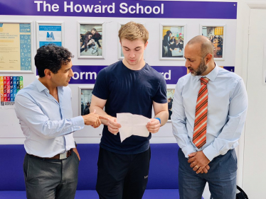 Rehman at a school with pupils